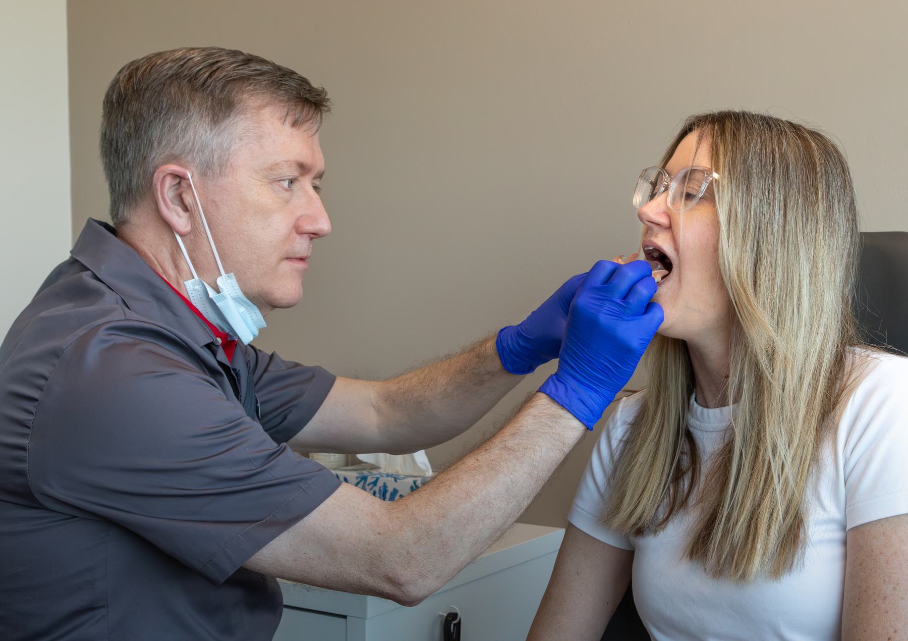 Michael Watson examining a patient